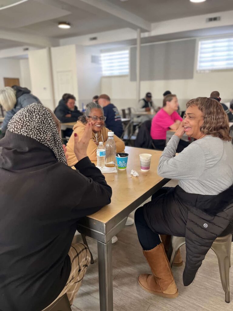 ComFe Ms. Bonnie fellowshipping with the guests at ComFE